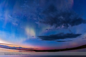 The all-sky aurora of June 22, 2015, during a level 7 to 9 geomagnetic storm, as the display began already active in the darkening twilight of a solstice night. This is one frame from a 960-frame time-lapse, taken with the 15mm full-frame fish-eye lens at f/2.8 and with the Canon 60Da, looking north to the perpetual twilight of solstice. I was on the south shore of Crawling Valley Lake and Reservoir in southern Alberta.