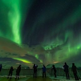 Aurora photographers and observers on the rear deck 9 area of the Hurtigruten ferry ship the ms Trollfjord on the southbound voyage along the Norwegian coast, on March 2, 2019. This is a single 1.6-second exposure at f/2 with the 15mm Venus Optics lens and Sony a7III at ISO 6400.