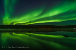Reflections of the Northern Lights in the calm waters of Madeline Lake on the Ingraham Trail near Yellowknife, NWT on Sept 7, 2019. This is one of a series of “reflection” images. The Big Dipper is at left; Capella at far right. This is a single 8-second exposure with the 15mm Laowa lens at f/2 and Sony a7III at ISO 1600.